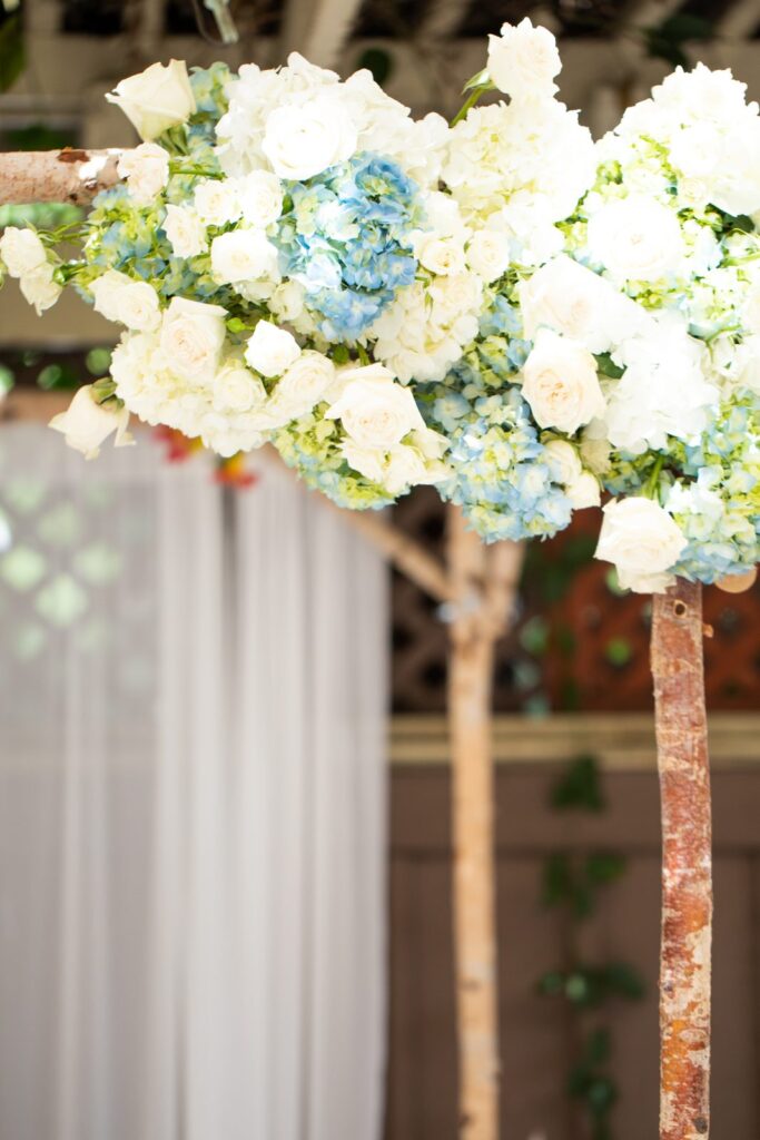 White rose and hydrangea floral arrangement at a wedding
